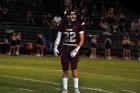Ethan Lege checks with the defensive coaches.